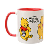 White stoneware Winnie the Pooh mug, 325ml, with glossy white body, red handle and red interior, showing Pooh in cheerful poses, on a plain white background.