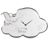 Cloud-shaped silver wall clock featuring an embossed flying Dumbo, stars, and "DREAM big little one" text, with black hands, on a plain white background.
