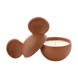 Mickey Mouse ceramic vessel scented candle in speckled terracotta, Mickey-ear lid propped beside the open bowl revealing cream wax and a single wick, on a white background.
