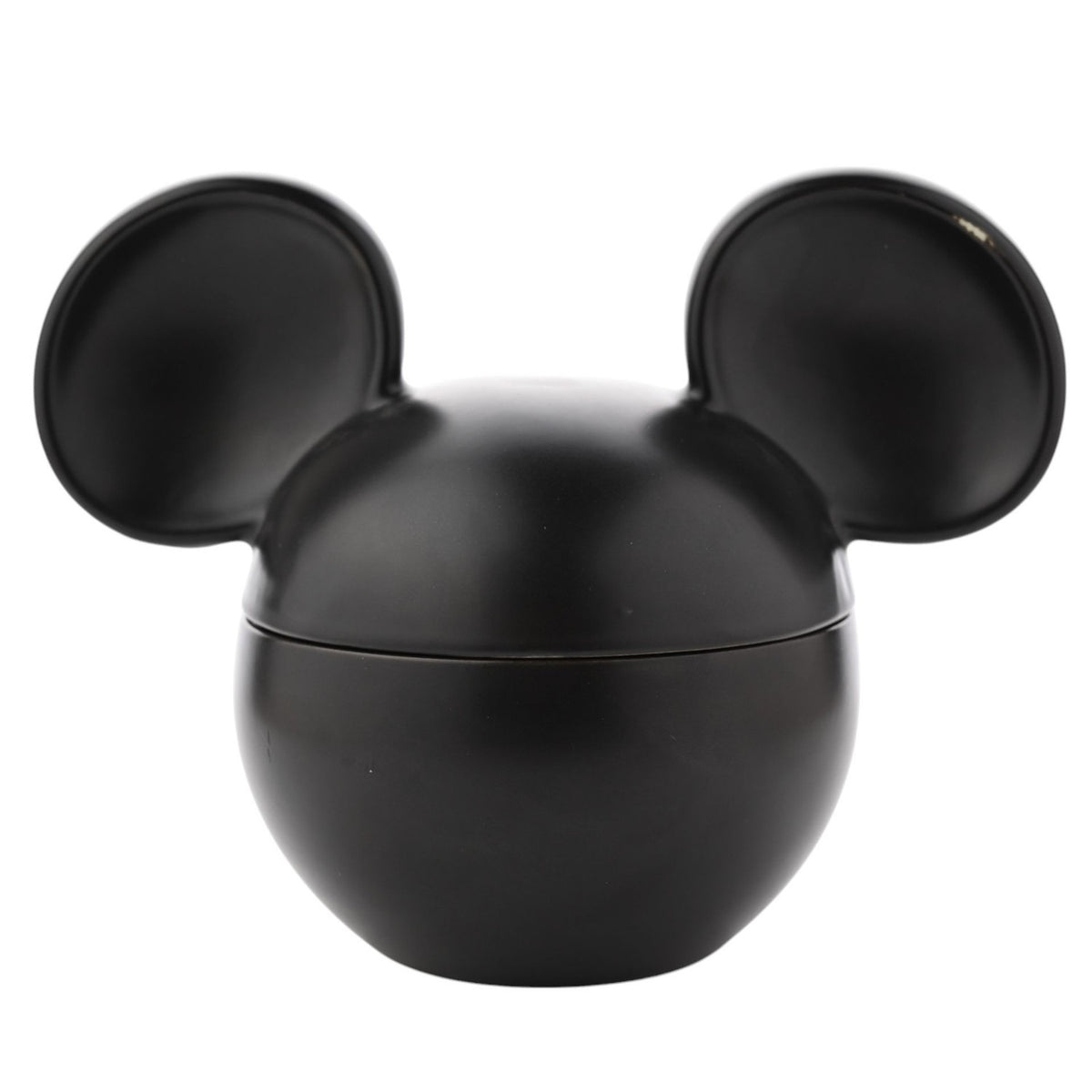 Mickey Mouse ceramic vessel scented candle in matt black, shaped like Mickey's head with lidded ears, on a plain white background.