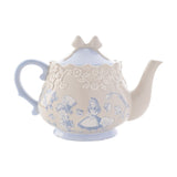 Alice in Wonderland stoneware teapot in beige with light blue handle, spout, and bow-shaped lid, featuring Alice and the Mad Hatter illustrations and a raised rose band, on a white background.