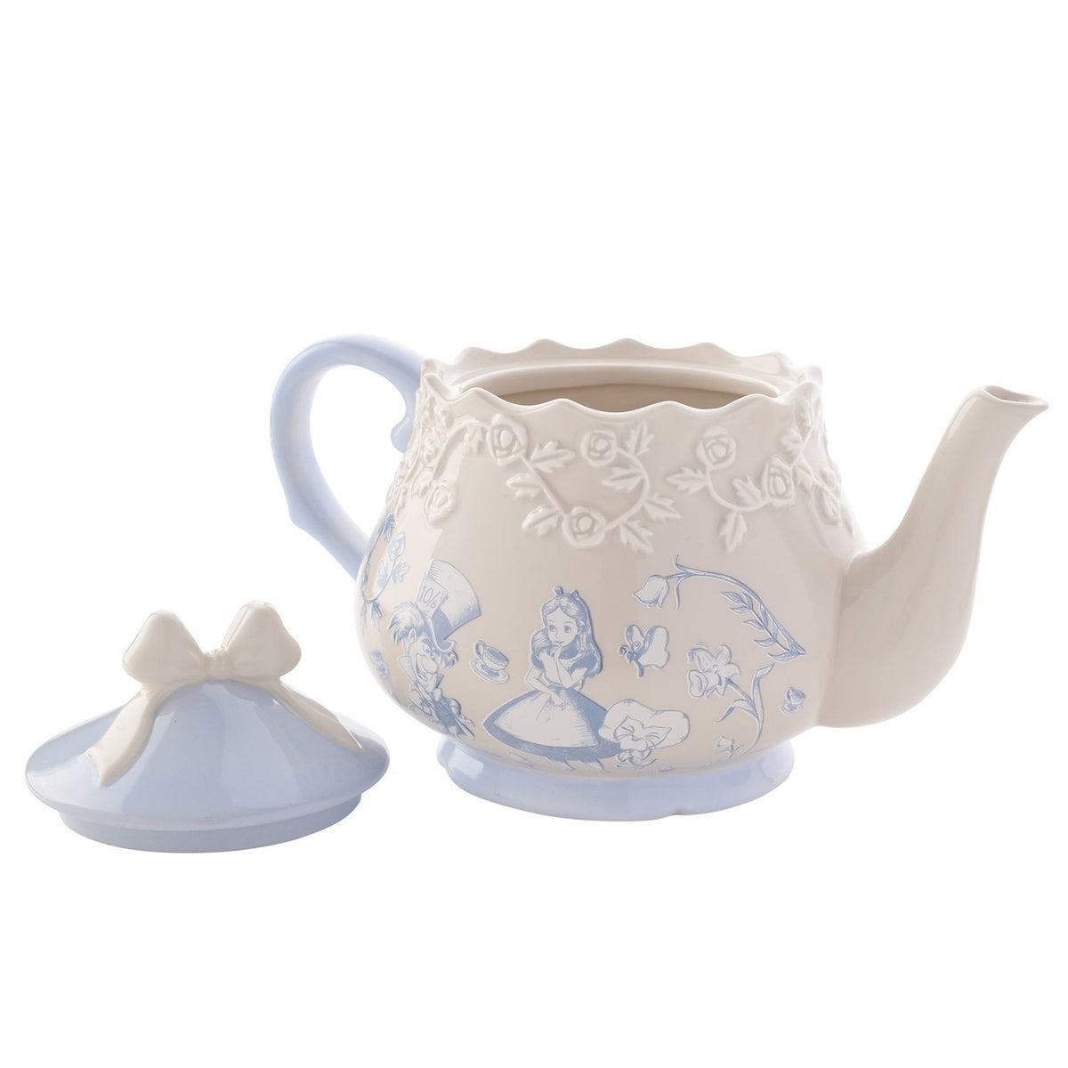 Beige stoneware teapot with light blue Alice and Mad Hatter decals, raised rose band, scalloped rim, and bow-handled lid resting beside it on a white background.