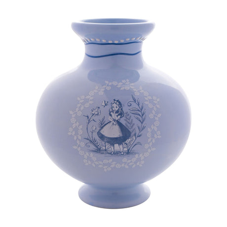 Round ceramic vase in glossy light blue with a flared neck, featuring a white and deep blue Alice in Wonderland design within a rose wreath, shown on a plain white background.