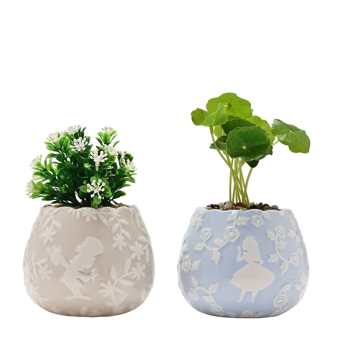 Set of two round ceramic mini planters with scalloped rims, beige and blue, each with raised white floral relief and faux green plants, on a white background.