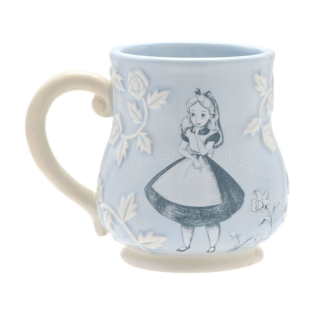 Blue embossed earthenware mug, 340ml, with a sketched Alice in Wonderland illustration, white relief roses and leaves, a cream handle, and script detail, on a plain white background.