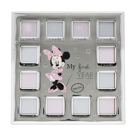Silver multi-aperture frame with twelve square photo windows labelled 1-12 months, a central Minnie Mouse in a pink polka-dot dress, My First Year text, and a Baby Girl wreath on a star background.