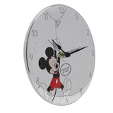 Round silver-plated wall clock with embossed Mickey Mouse holding a balloon, clouds and stars on the dial, black hands and red accent, set on a white background.