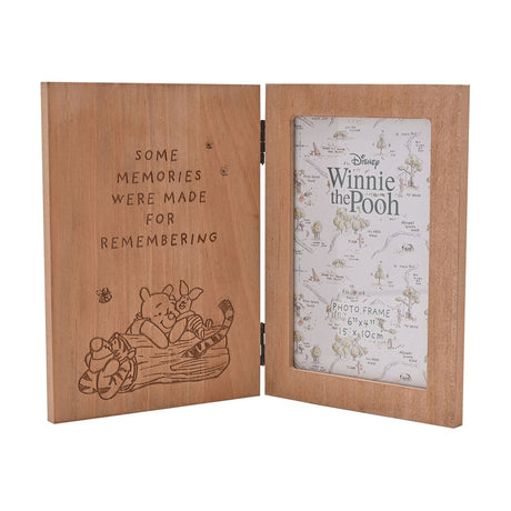 Winnie the Pooh engraved folding wooden photo frame in brown, left panel reading "some memories were made for remembering" with Pooh, Piglet and Tigger, right panel holding a 6x4" photo.