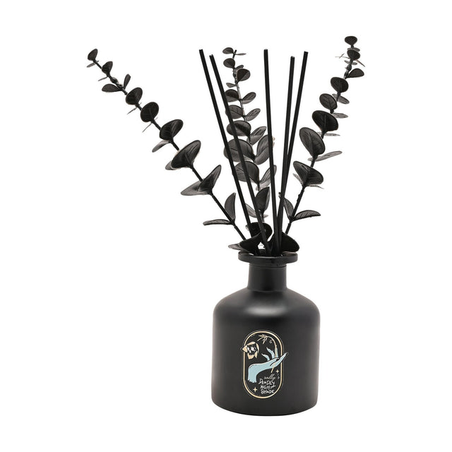 Nightmare Before Christmas reed diffuser in a rounded black bottle with black reeds, gold-edged label featuring Sally's Deadly Night Shade design, on a white background.