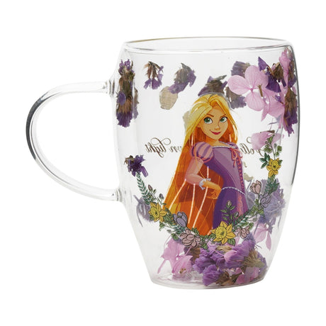 Clear glass mug with handle, featuring Rapunzel in a lilac dress surrounded by pressed purple, lilac and yellow flowers set within the glass, on a white background.