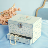 Pastel Princess Cinderella Musical Jewellery Box with Drawer, rectangular white box with floral print and silver clasp, open drawer showing pearl beads, styled beside dried pink flowers.