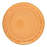Round porcelain saucer in yellow with gold rim, printed "Live Your Story" text and small rose motifs encircling a raised centre, shown on a plain white background.
