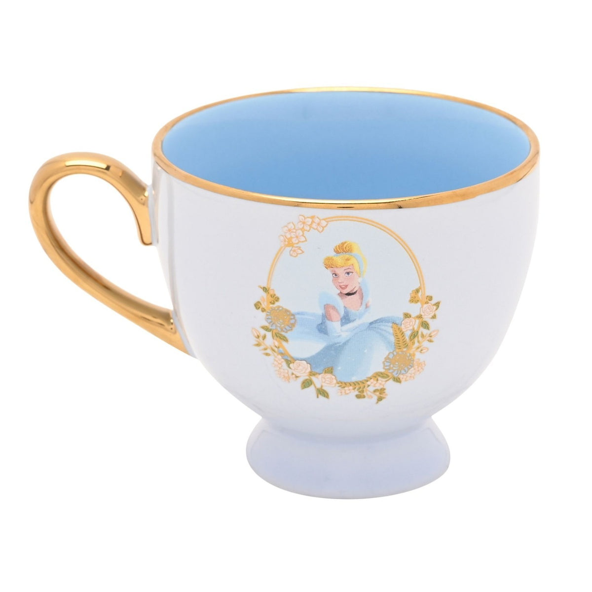 Cinderella porcelain tea cup in white with gold rim and handle, blue glazed interior, footed base, and a gold oval floral frame showing Cinderella on the side, set against a plain white background.