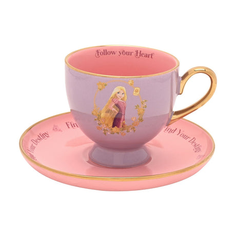 Rapunzel Pastel Princess porcelain tea cup and saucer in lilac and pink with gold handle and rim, featuring Rapunzel within a gold floral frame, set on a plain white background.