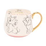 White porcelain mug with pencil-style sketches of Marie the kitten, gold rim, handle, and lettering reading "Marie" with hearts, pink base band, 400ml, on a plain white background.