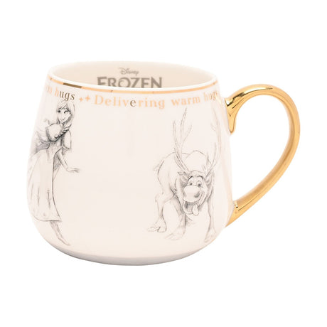 White porcelain Frozen mug with gold handle and rim line, featuring pencil-sketch style illustrations of Anna and Sven and "Delivering warm hugs" lettering, shown on a plain background.