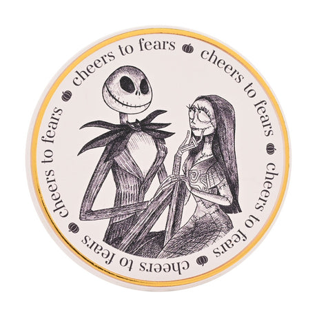 Round white stoneware coaster featuring a black linework illustration of Jack Skellington and Sally, bordered by a gold rim and "cheers to fears" text with pumpkin icons.