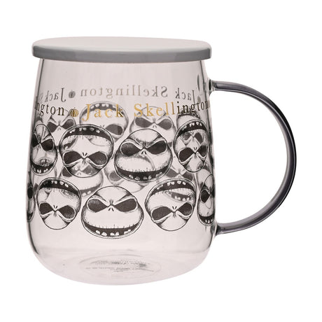 Clear glass mug with lid, 570ml, featuring repeated black and white Jack Skellington face prints, gold "Jack Skellington" lettering near the rim, and a grey handle, shown on a white background.