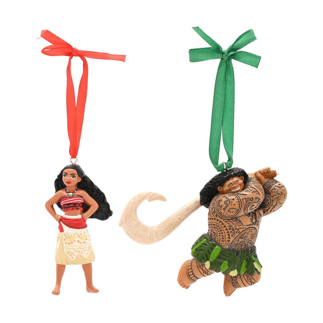 Moana and Maui resin hanging Christmas tree decorations, Moana in red top and cream skirt, Maui mid-leap with tattoos and green leaf skirt, on white background.