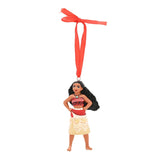Moana hanging Christmas tree decoration in resin with matt finish, standing with hands on hips, red top and sash, cream patterned skirt, red ribbon hanger, on a white background.