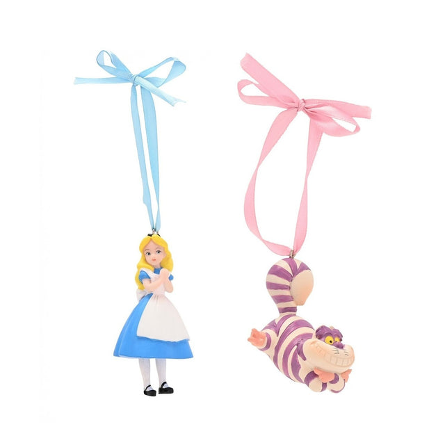 Alice and Cheshire Cat resin Christmas tree decorations with ribbon hangers, Alice in blue dress with white apron on blue ribbon, striped Cheshire Cat on pink ribbon.