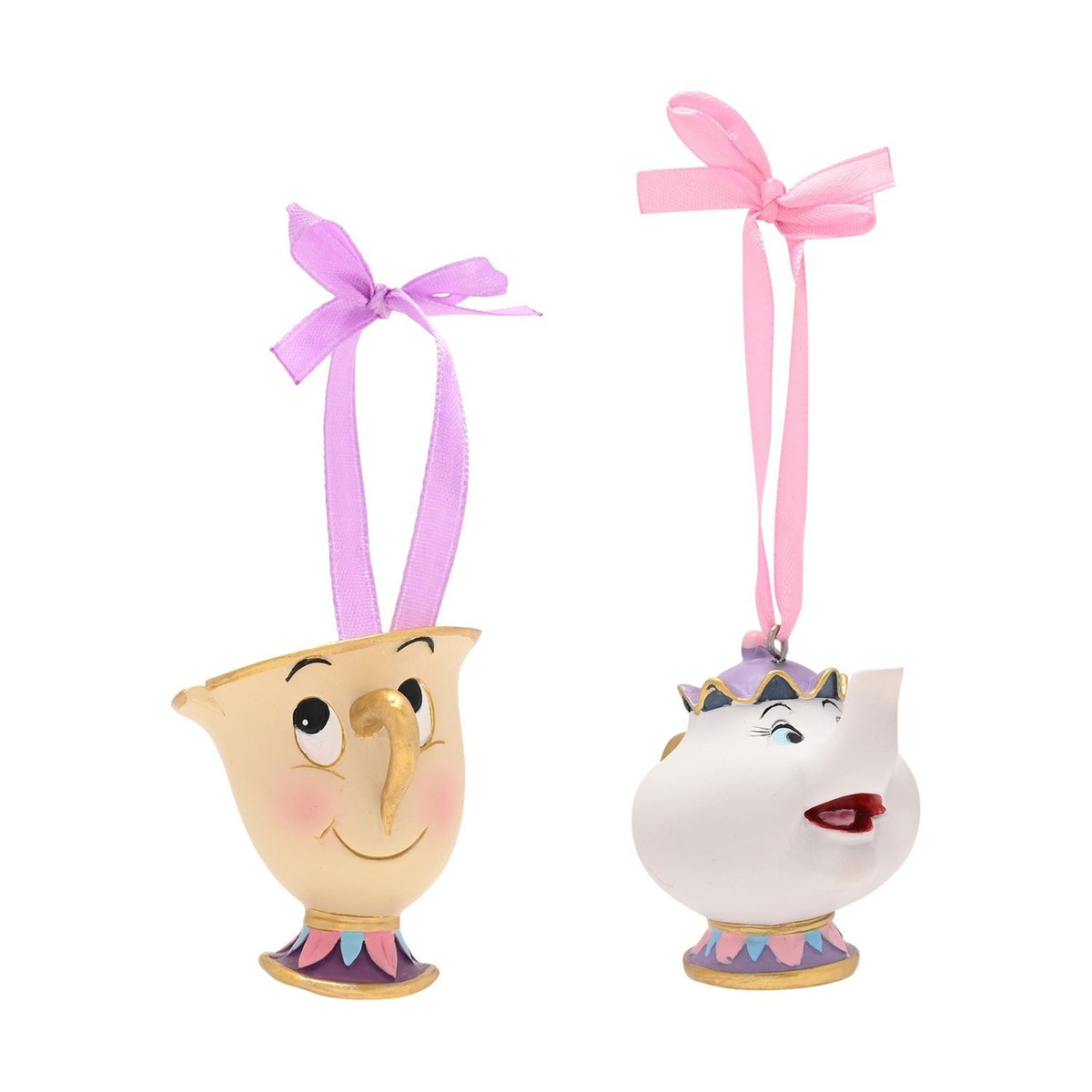 Chip and Mrs Potts resin hanging Christmas tree decorations, cream teacup and white teapot with painted faces, gold rims, purple and pink ribbons, on a plain white background.