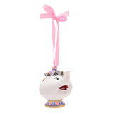 Mrs Potts hanging Christmas tree decoration, a resin white teapot with gold handle, purple crown-shaped lid, painted face and pink ribbon loop, on a plain white background.