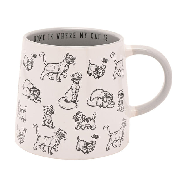 White stoneware mug with black line-drawn cats and kittens around the body, grey handle, and "Home Is Where My Cat Is" printed inside the rim, on a plain background.