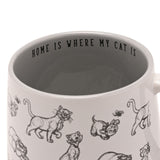 White stoneware mug with black cat sketches around the exterior and "HOME IS WHERE MY CAT IS" printed inside the rim, 400ml, grey interior glaze.