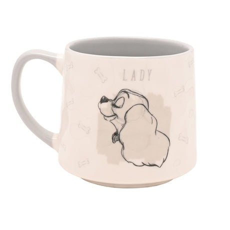 White stoneware mug with grey interior, featuring a sketch-style drawing of Lady in profile and "LADY" lettering, with bone outlines on a cream background.