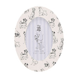 Oval wooden photo frame in white with black sketched dog illustrations, including Dalmatians and Lady and the Tramp, holds a 6 x 4in photo, shown on a plain background.