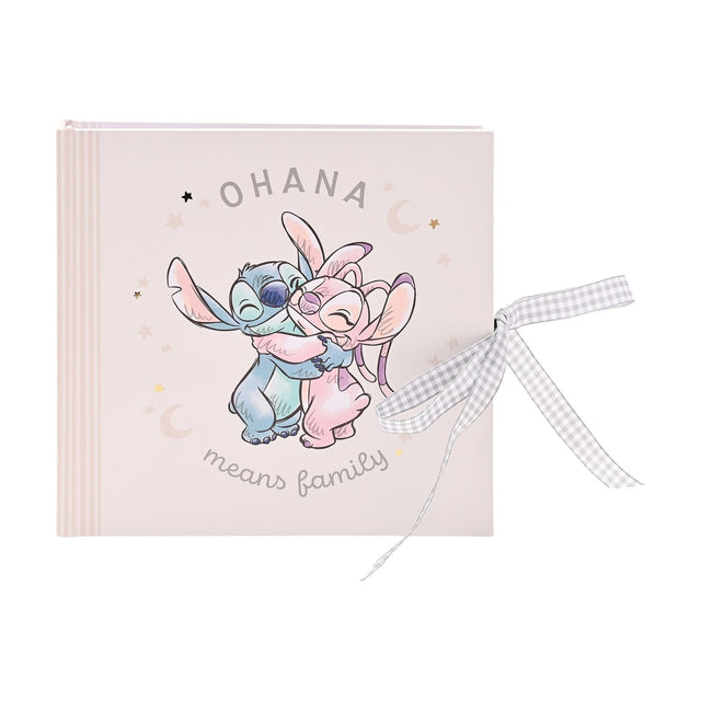 Square pale pink Ohana Stitch baby photo album with Stitch hugging a pink friend under stars and moons, grey gingham ribbon tie, plain white background.