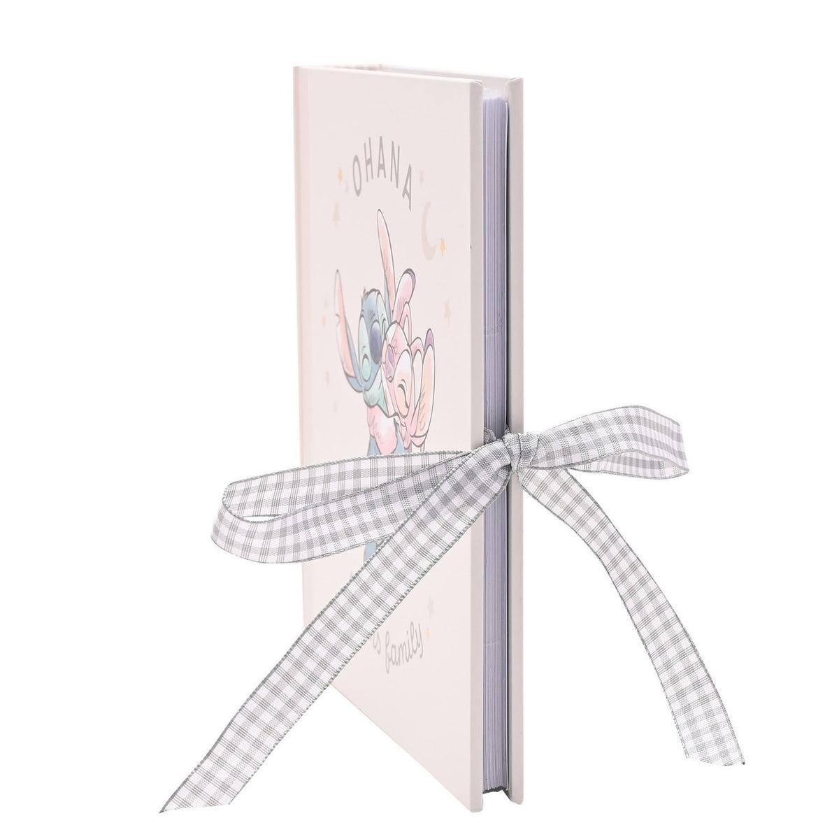 Ohana Stitch Baby Photo Album, pale pink matt cover with Stitch hugging a pink friend under stars, tied with a grey gingham ribbon, shown upright on a white background.