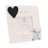 Off-white pink-tinted wooden frame with a black chalkboard heart reading days until we meet our little one, gold stars and moons, a raised Stitch cut-out, and a 4 x 3in photo window.