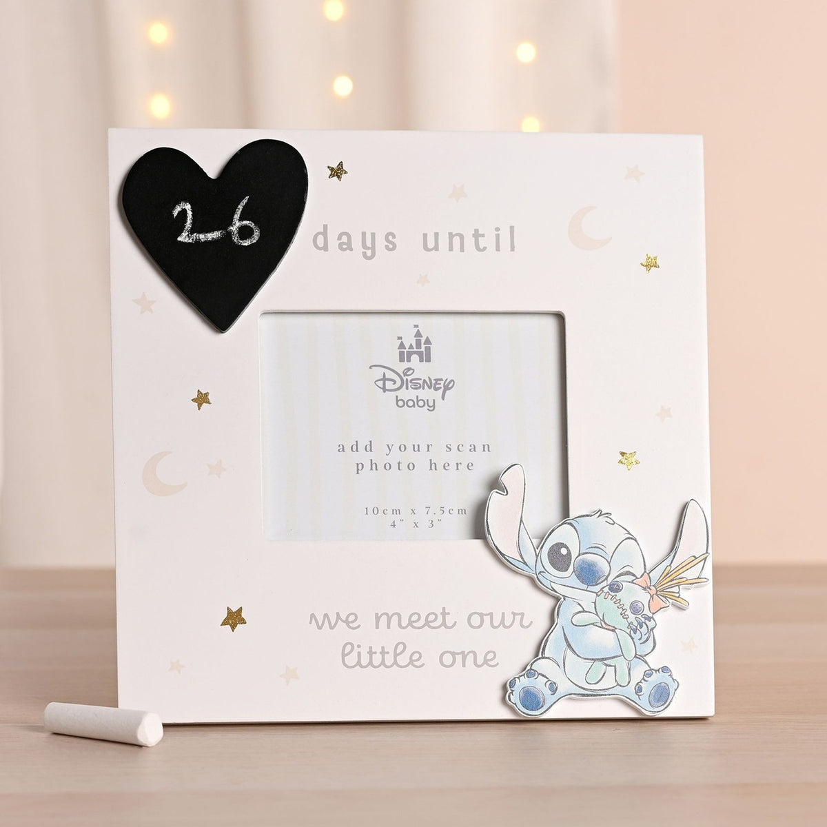 White wooden square photo frame with black chalkboard heart countdown, Stitch cut-out, gold stars and moons, "days until we meet our little one" text, 4x3in scan window.