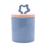 Stitch Stoneware Storage Jar with Star Knob 900ml in blue, round ceramic body with a pale pink lid and matching wavy star-shaped knob, shown on a plain white background.
