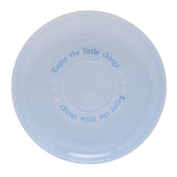Round pale blue porcelain saucer from the Winnie the Pooh Eeyore Cup & Saucer set, printed with "Enjoy the little things" in blue text, shown on a white background.