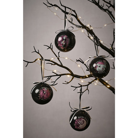 Set of four glossy black round tree baubles hanging from decorative branches with fairy lights, each printed with a pink, white and pale blue Nightmare Before Christmas character panel.