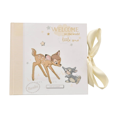 Bambi Baby Photo Album, white with striped cream spine, featuring Bambi and a grey rabbit, "Welcome to the world little one" text, and a cream ribbon tie, on a plain background.