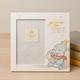 White square photo frame for a 6 x 4in photo, featuring a smiling Dumbo illustration with "you make me SMILE" in gold text amid clouds and stars.