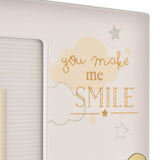 White square photo frame for a 6 x 4in photo, detailed with "you make me SMILE" in gold glitter script, pale clouds, and grey and gold stars.
