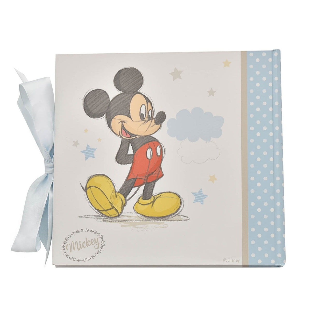 Mickey Mouse 6 x 4in photo album with cream cover, sketched Mickey in red shorts and yellow shoes, stars and cloud design, blue polka dot spine, and blue ribbon tie on white background.