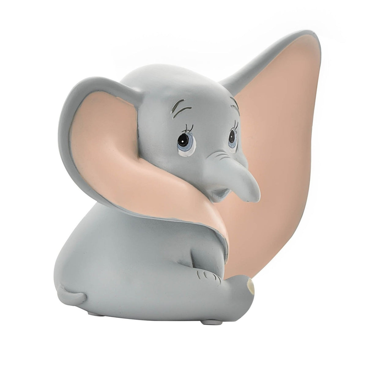 Sitting Dumbo elephant resin money box in matt grey with pale pink ear interior, trunk tucked down and large ear swept forward, on a plain white background.