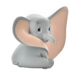Sitting Dumbo elephant resin money box in matt grey with pale pink ear interior, trunk tucked down and large ear swept forward, on a plain white background.