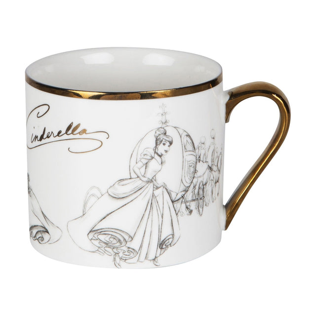 White porcelain Cinderella mug with grey pencil-style sketches of Cinderella and her coach, gold rim and handle, "Cinderella" script, shown on a plain white background.