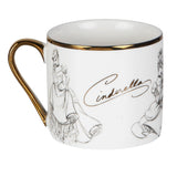White porcelain Cinderella Sketch mug with gold rim and handle, featuring grey pencil-style sketches of Cinderella and her gown, with her name in gold script, on a plain background.