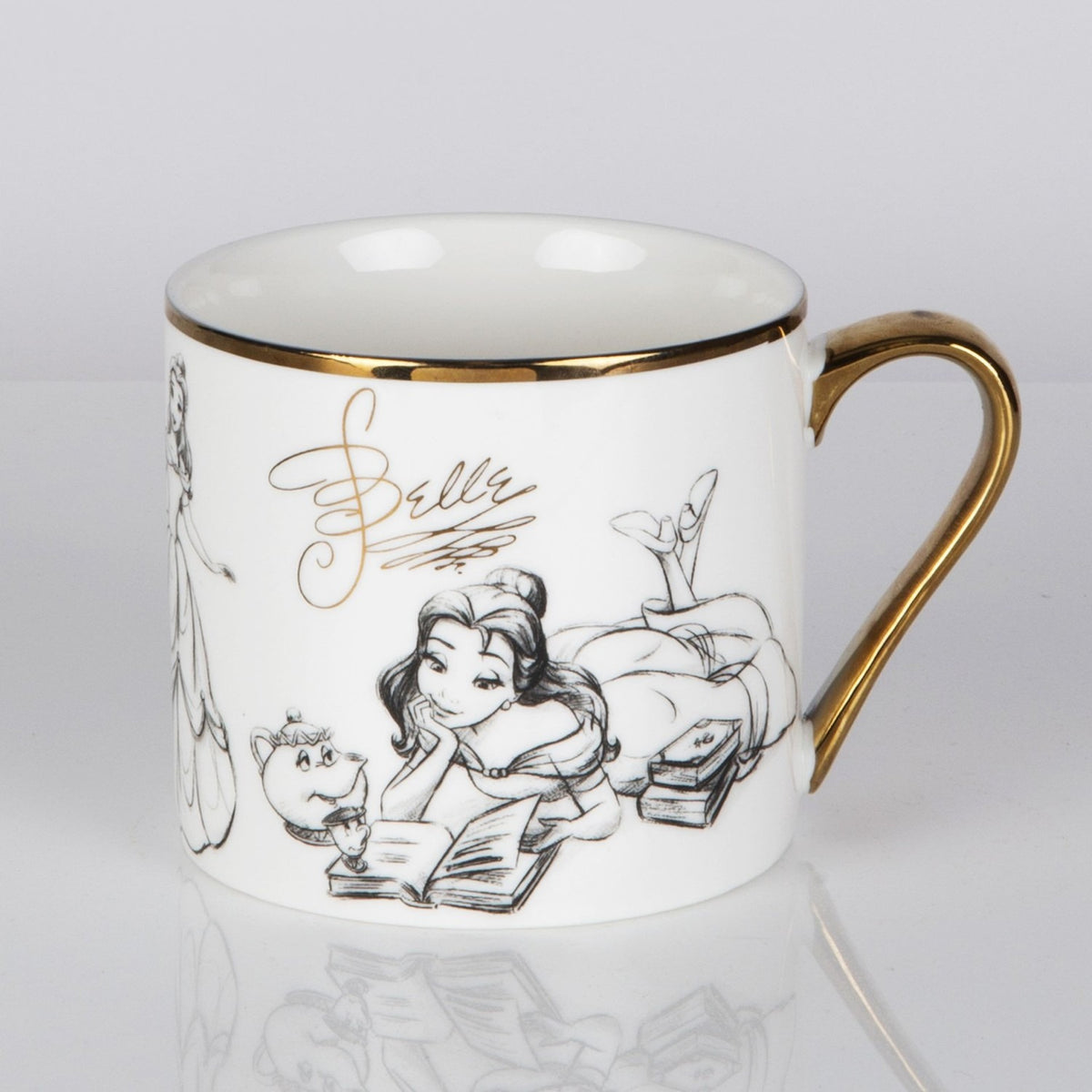 Belle Sketched Classic Collectable Porcelain Mug in white with gold rim and handle, pencil-style sketch of Belle reading beside Mrs Potts and Chip, on a plain background.