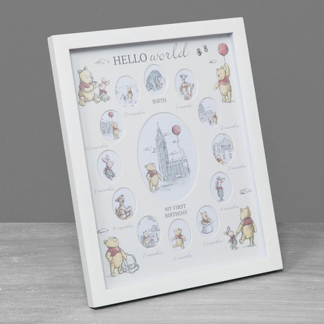 White MDF multi-aperture photo frame with stand, cream finish, featuring twelve oval month openings around a central image, "Hello World" text, shown against a grey background.