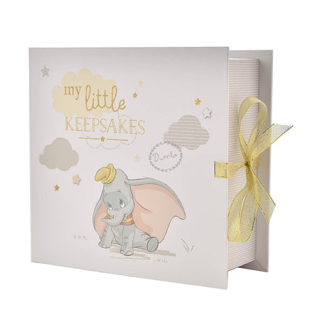 Square white paperwrap keepsake box featuring Dumbo among pastel clouds and gold stars, with "my little KEEPSAKES" text and a gold ribbon closure, shown on a plain background.