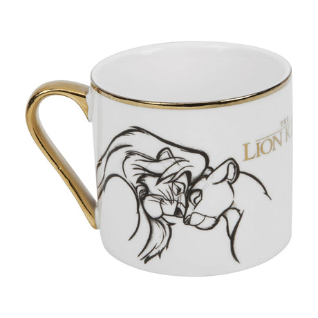 White porcelain mug with gold handle and rim, featuring a sketch-style line drawing of two nuzzling lions and "The Lion King" title in gold, shown on a plain background.